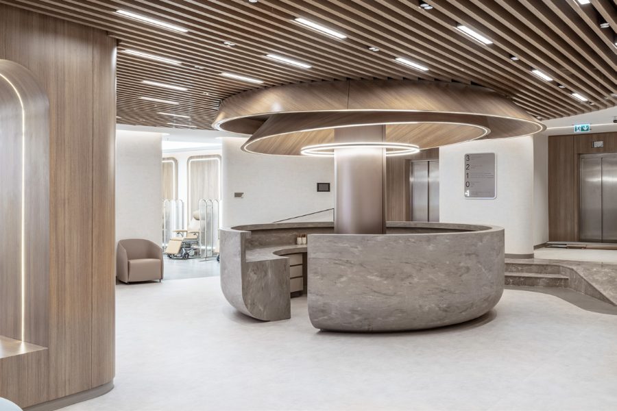 Vera Clinic reception — marble desk under a wood-slat ceiling, Istanbul